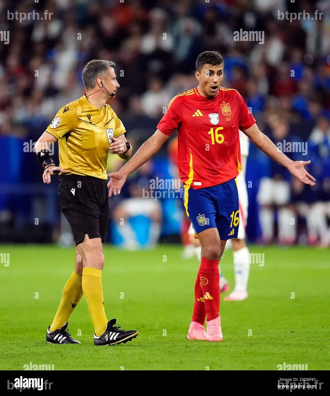 Spain's Rodri is booked by referee Slavko Vincic during the UEFA Euro ...