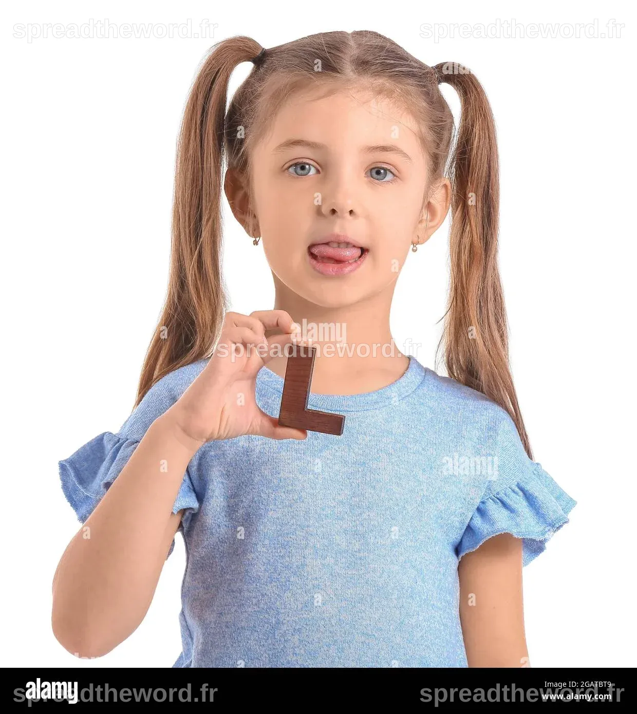 Little girl with letter L on white background Stock Photo - Alamy